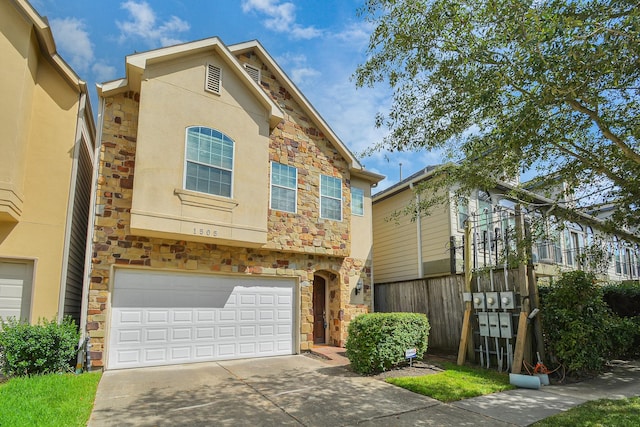 townhome / multi-family property featuring a garage