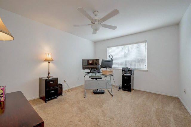 office space featuring light colored carpet and ceiling fan