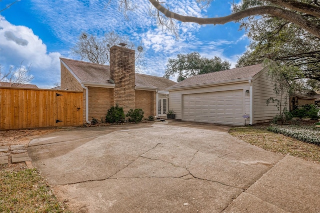 ranch-style house featuring a garage