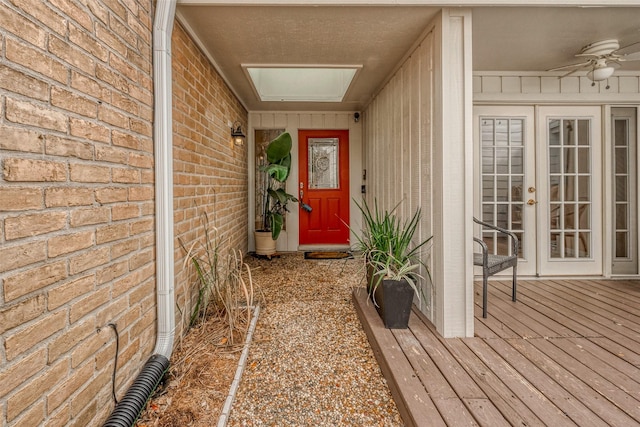 doorway to property featuring french doors and ceiling fan