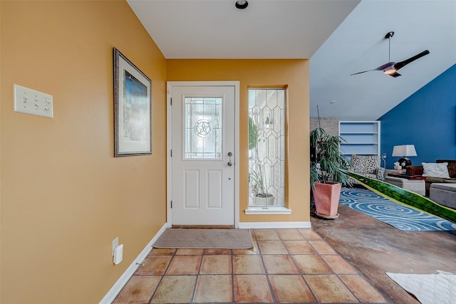 foyer featuring light tile patterned floors and ceiling fan