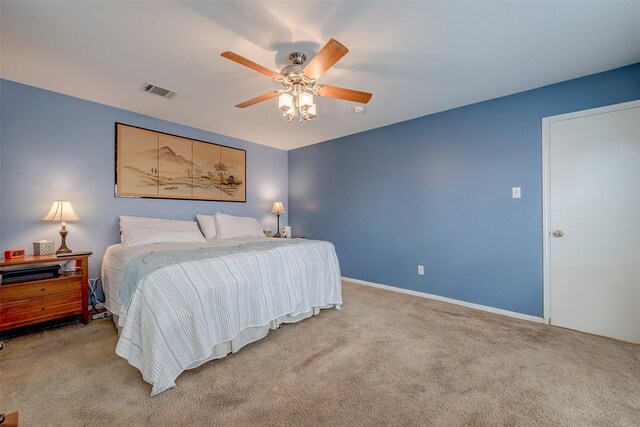 carpeted bedroom with ceiling fan