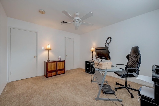 office area with light colored carpet and ceiling fan