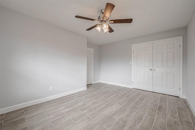 unfurnished bedroom featuring a closet and ceiling fan