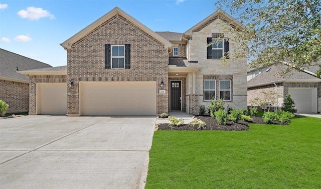 view of front of home featuring a garage and a front yard