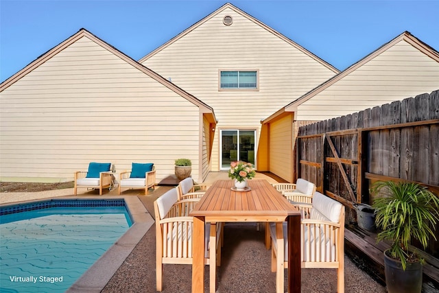 rear view of house featuring outdoor lounge area and a patio