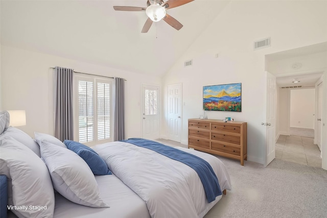 bedroom featuring high vaulted ceiling, light colored carpet, and ceiling fan