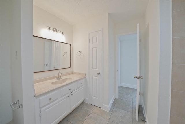 bathroom with vanity and tile patterned flooring