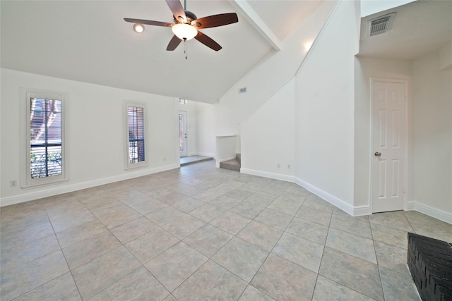 unfurnished living room with vaulted ceiling, ceiling fan, and light tile patterned flooring