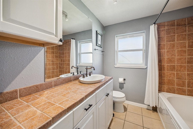 full bathroom with tile patterned flooring, vanity, toilet, and shower / bath combo