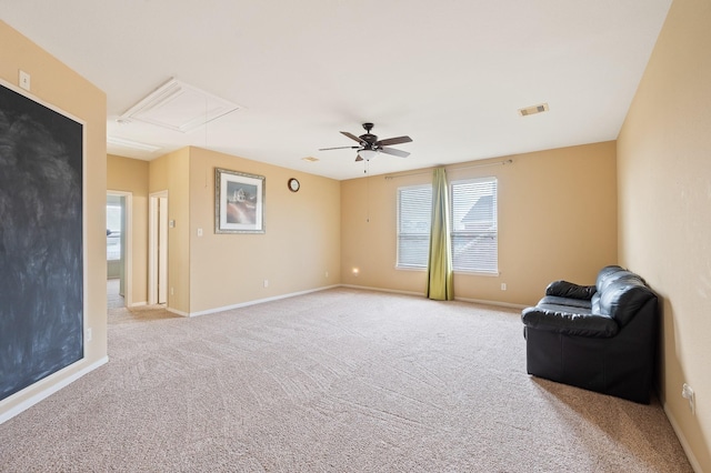 unfurnished room featuring light carpet and ceiling fan