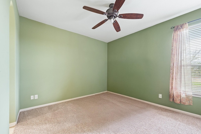 carpeted empty room with ceiling fan