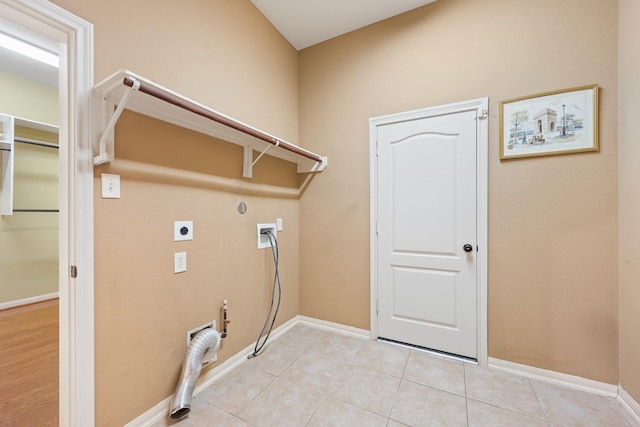 laundry room with hookup for a washing machine, hookup for a gas dryer, hookup for an electric dryer, and light tile patterned flooring