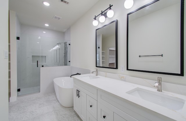 bathroom with shower with separate bathtub and vanity