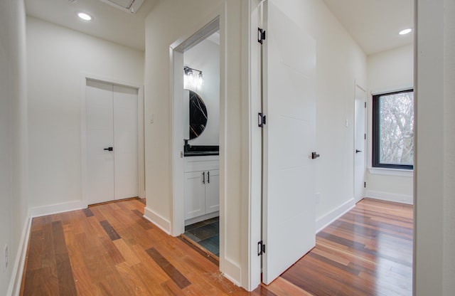 corridor with light wood-type flooring