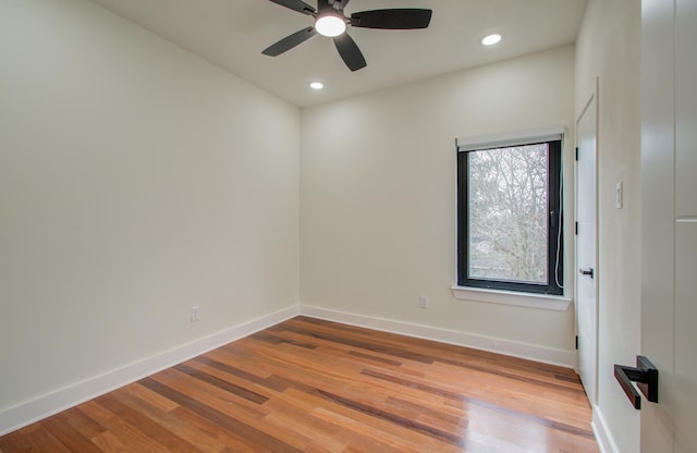 spare room featuring ceiling fan and wood-type flooring