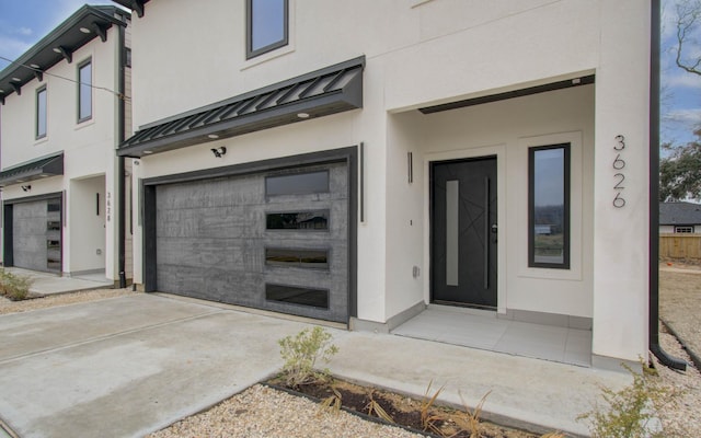 property entrance featuring a garage