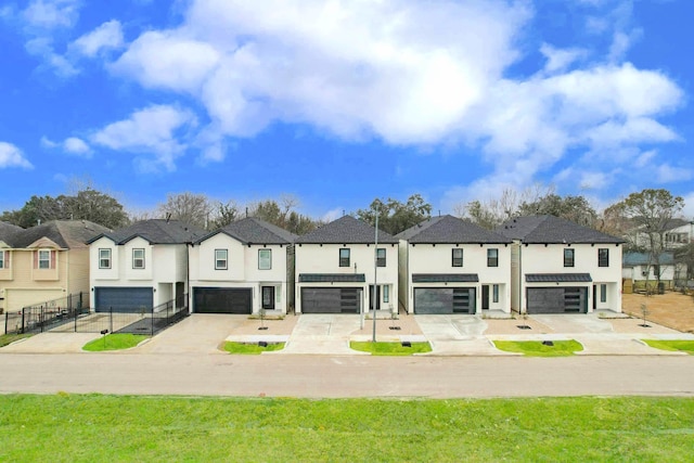 view of front facade with a garage and a front lawn