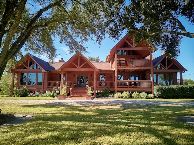 cabin with a front lawn