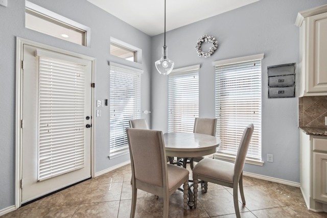 dining room with light tile patterned flooring