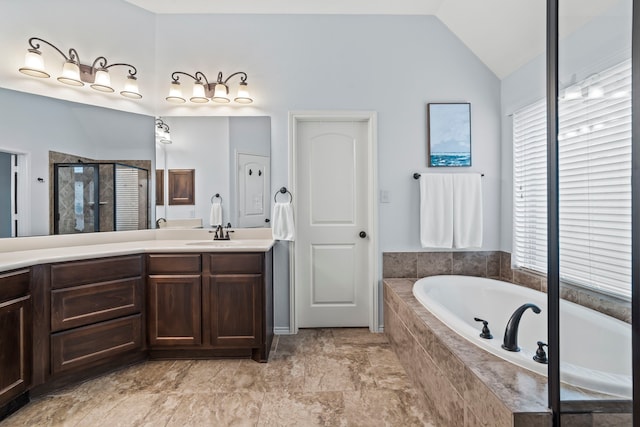 bathroom with plus walk in shower, lofted ceiling, and vanity