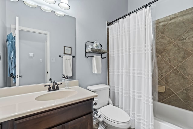 full bathroom with vanity, shower / tub combo with curtain, and toilet