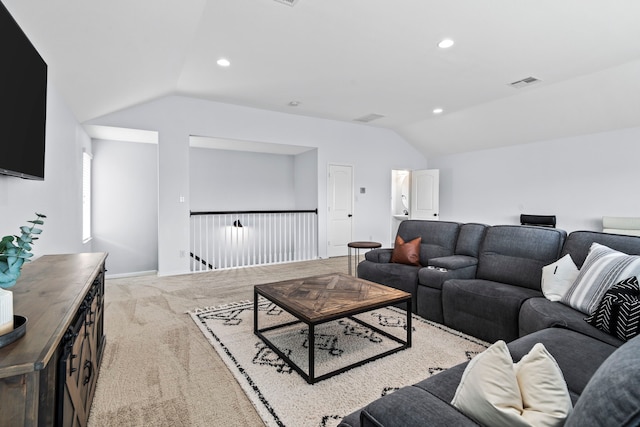 living room featuring lofted ceiling and light carpet