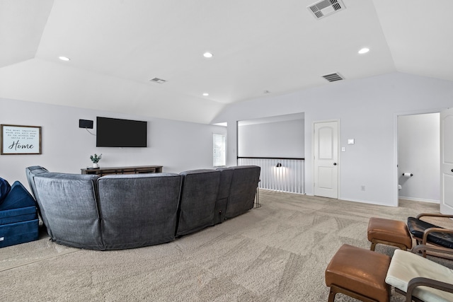 home theater room featuring light colored carpet and lofted ceiling