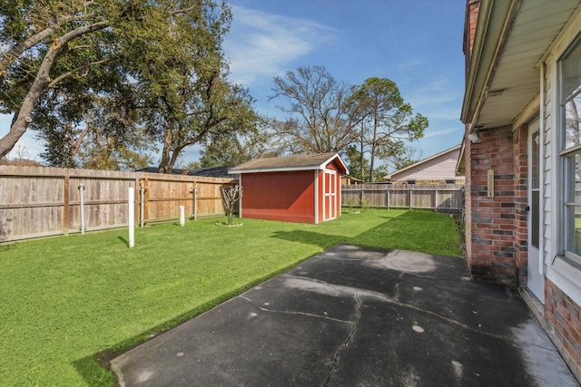 view of yard with a shed and a patio