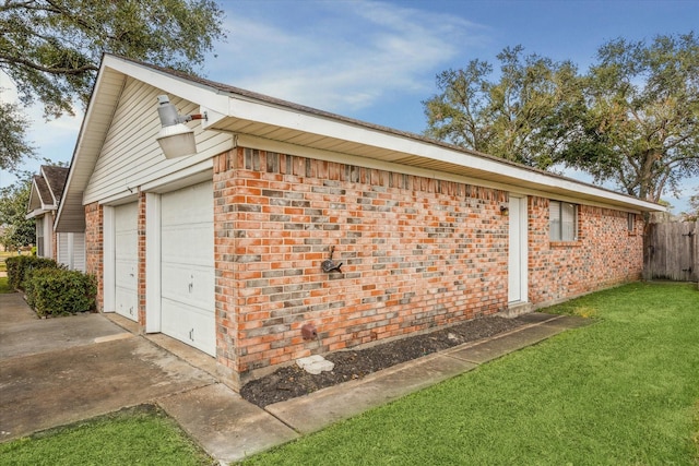 view of property exterior with a garage and a lawn