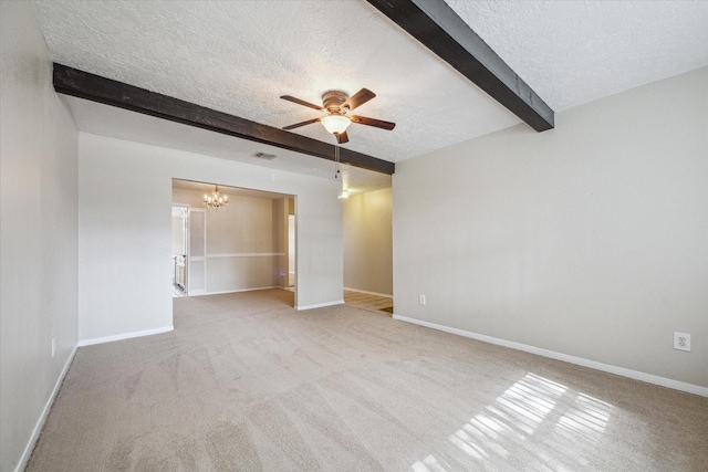 unfurnished room with a textured ceiling, ceiling fan with notable chandelier, light colored carpet, and beamed ceiling