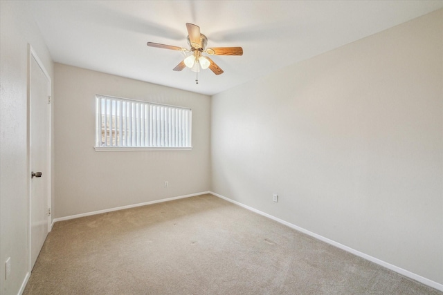 unfurnished room with light carpet and ceiling fan