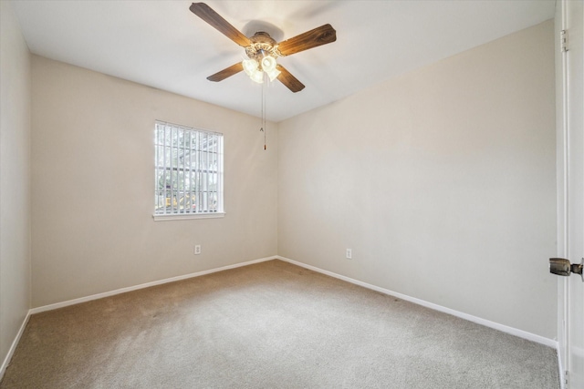 unfurnished room with ceiling fan and carpet flooring