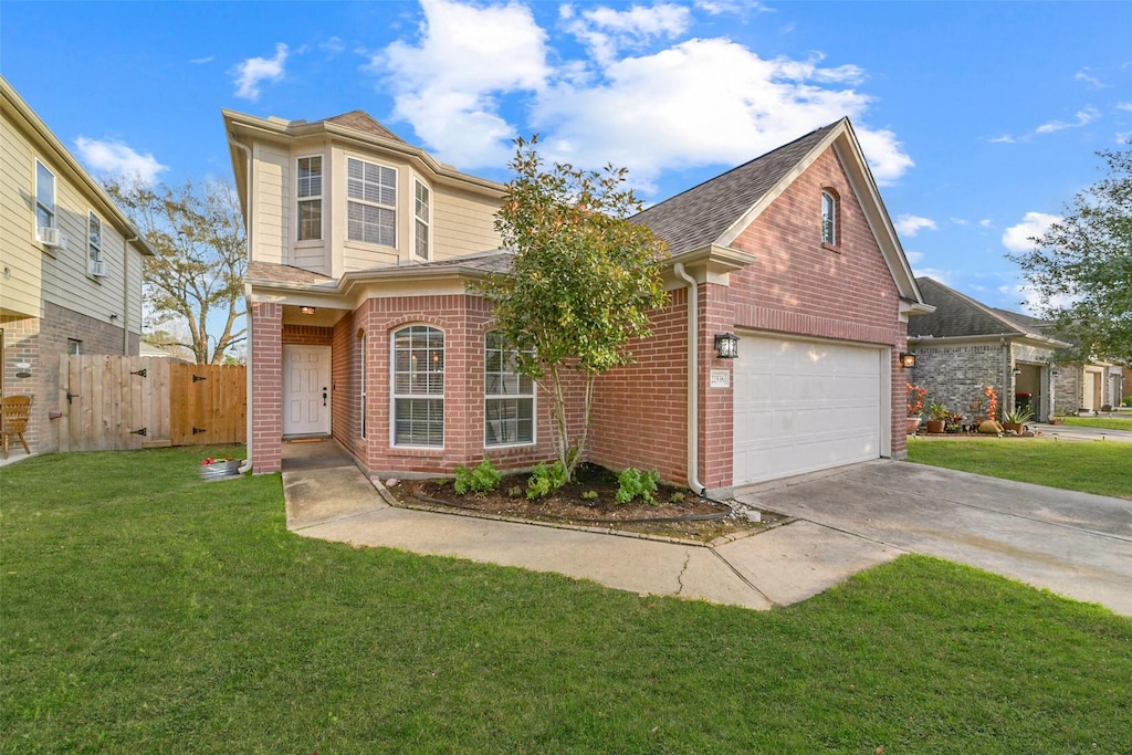 front facade with a garage and a front yard