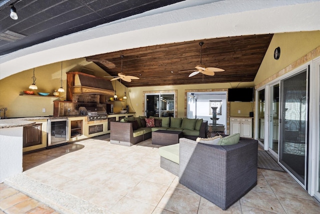 view of patio / terrace with wine cooler, area for grilling, outdoor lounge area, and ceiling fan