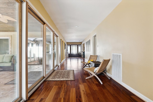 hallway with hardwood / wood-style flooring