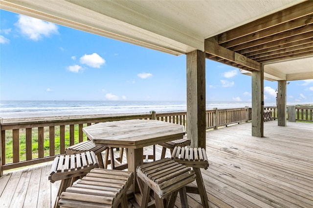 deck featuring a water view and a view of the beach