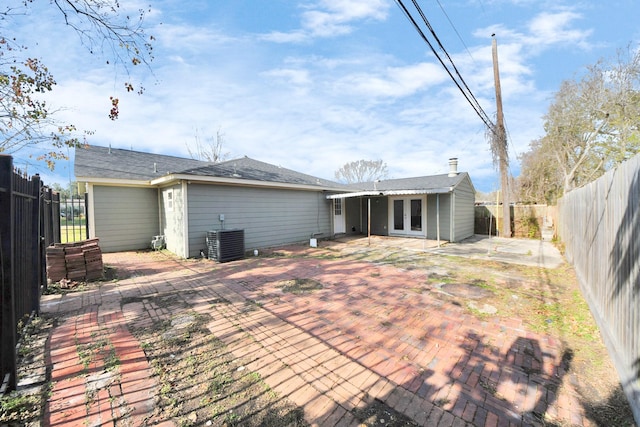 back of property featuring central AC and a patio area