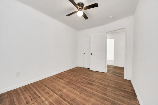 unfurnished room with dark hardwood / wood-style floors and ceiling fan