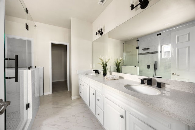 bathroom featuring vanity and a shower with shower door