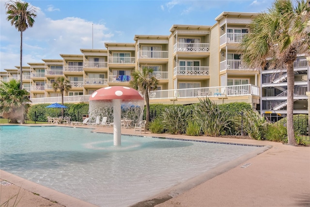 view of swimming pool featuring pool water feature