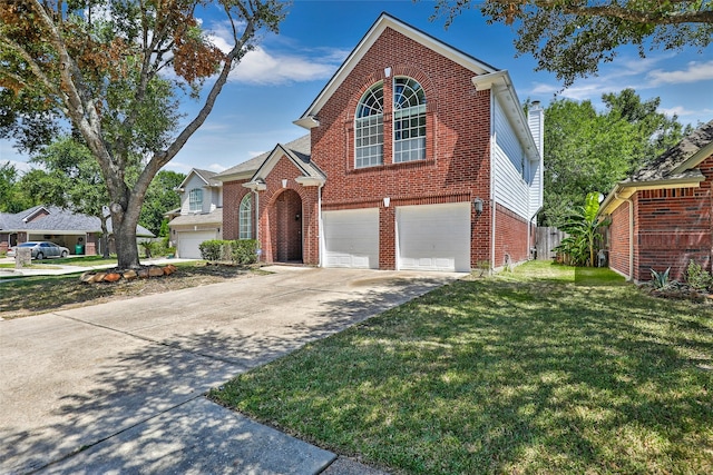 view of front property with a garage and a front lawn