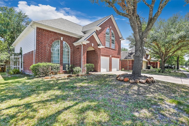 view of front of home with a garage and a front lawn