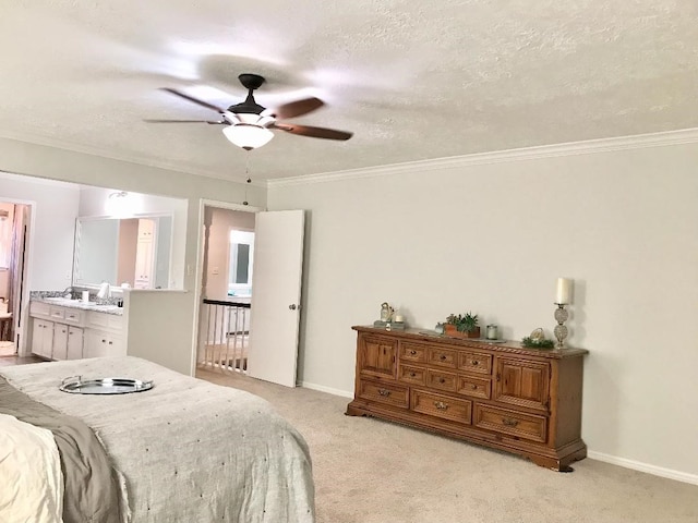 bedroom featuring connected bathroom, light carpet, a textured ceiling, ornamental molding, and ceiling fan