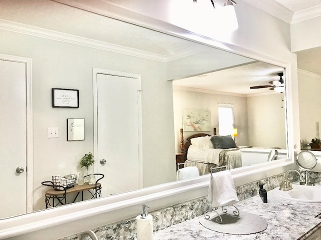 bedroom with crown molding and sink