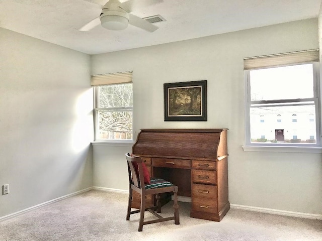 office space with light colored carpet and ceiling fan