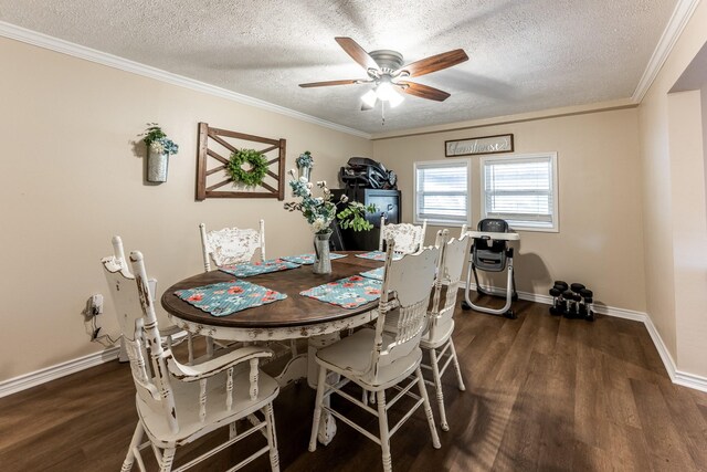 dining space with a textured ceiling, dark wood-type flooring, ornamental molding, and ceiling fan