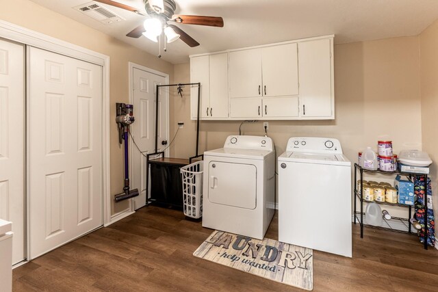 laundry area with cabinets, washing machine and clothes dryer, ceiling fan, and dark wood-type flooring