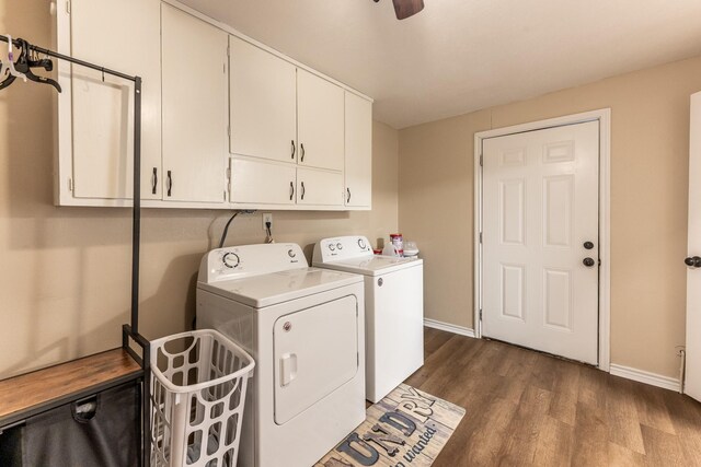 clothes washing area featuring dark hardwood / wood-style floors, washer and clothes dryer, cabinets, and ceiling fan