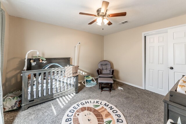 bedroom featuring ceiling fan, a closet, and carpet